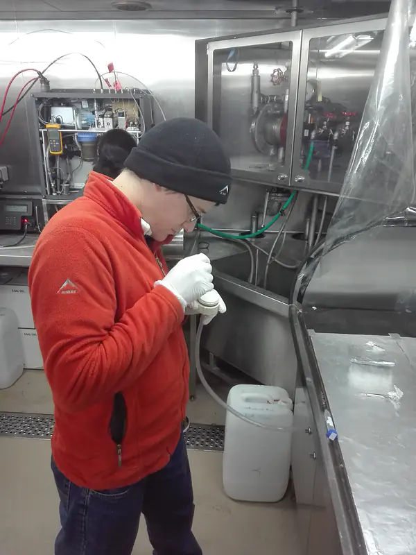Changing filters used to collect phytoplankton (microscopic algae) for pigment analysis.