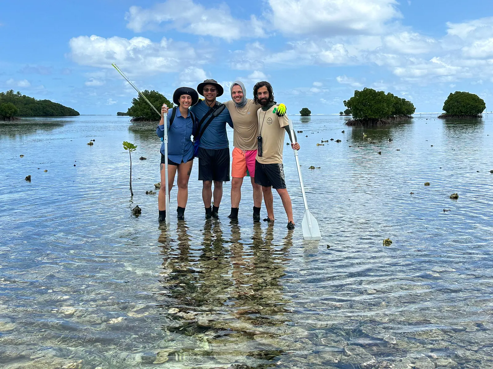 Fieldwork in the Federated States of Micronesia (collecting surface sediment samples to better understand sediment transport dynamics)
