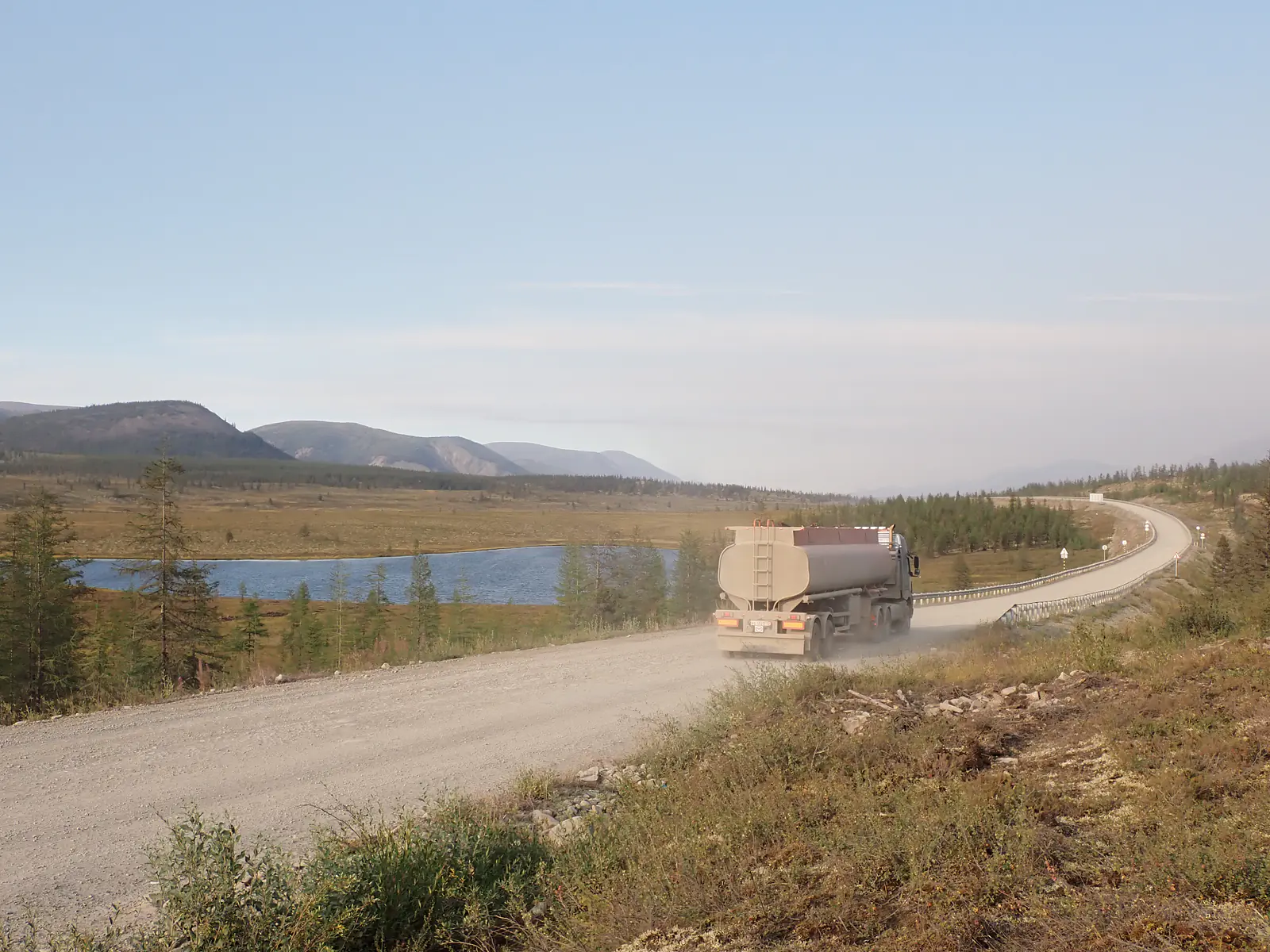 Russia, Republic of Sakha (Yakutia), Oymyakonsky District (2021): Truck on the Kolyma Highway in the southern Verkhoyansk Mountains