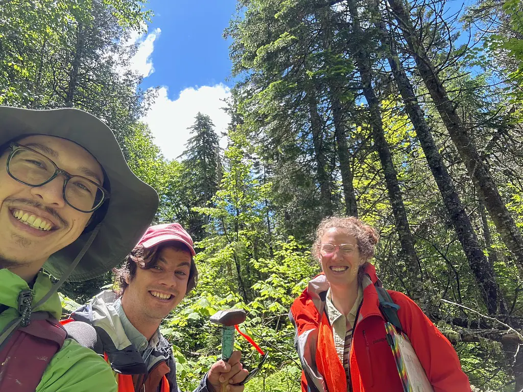 Ryan Gray (MIT '25) and Cemil Arkula (U. Maine) in the swamp looking for outcrops with Juliet.