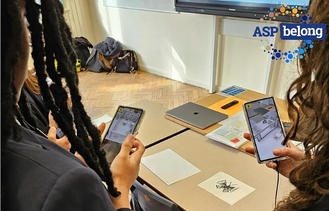 Children are shown using their phone cameras to scan symbols in their classroom as part of the ASP-belong play test.