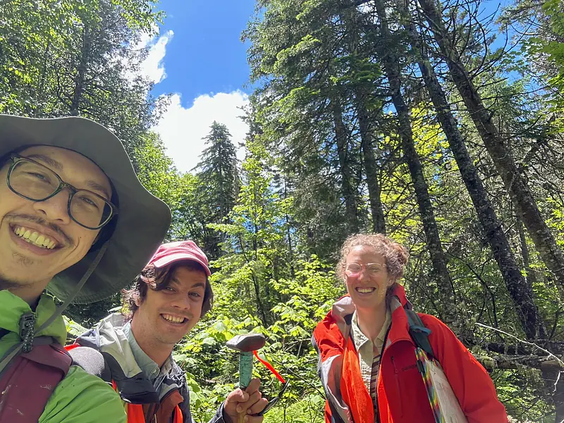 Ryan Gray (MIT '25) and Cemil Arkula (U. Maine) in the swamp looking for outcrops with Juliet.