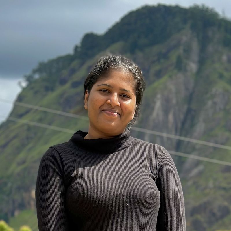 Portrait image of Wageesha, against a backdrop of mountains