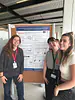 Sylvia, Iratxe and Naia proudly standing by the poster