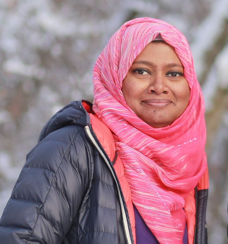 An image of Kazi Sinthia Kabir with foliage visible in the background.