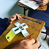 Students assembling their own Foldscope during the workshop.