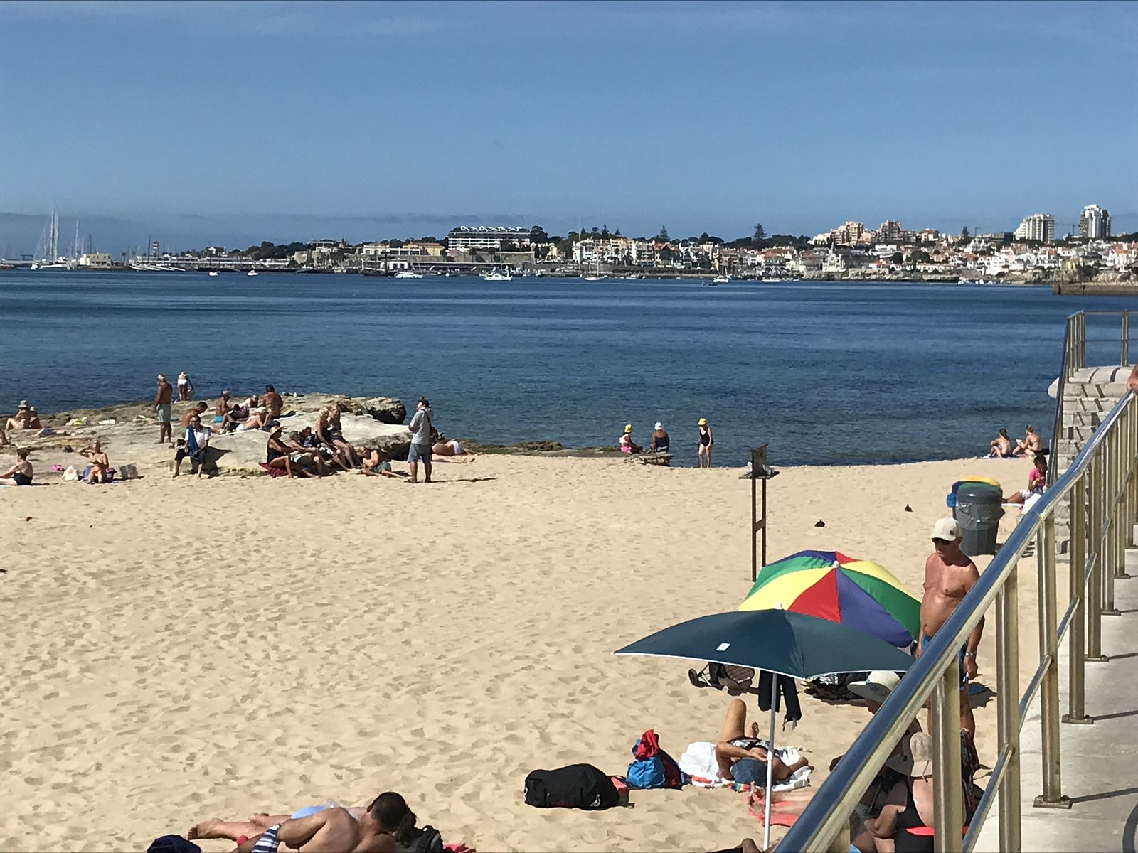 A photo of a sandy beach with the blue sea in the background