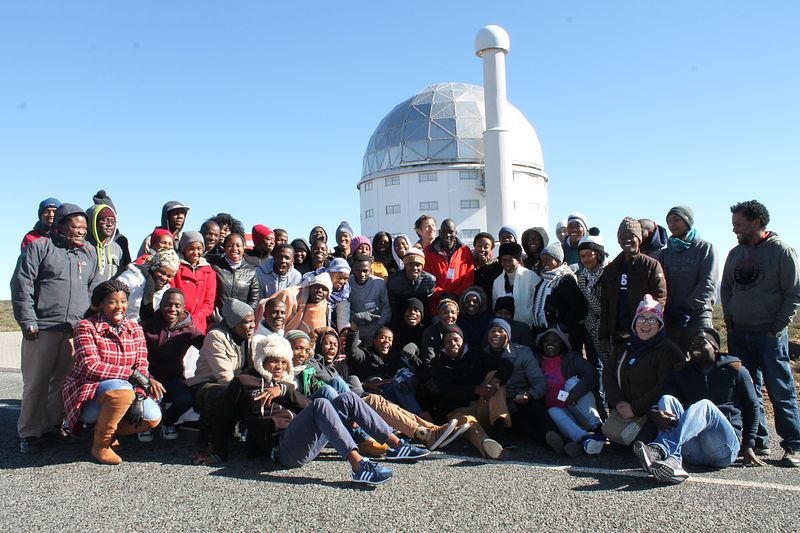 The whole School visiting the South African Large Telescope. They all look happy but COLD!