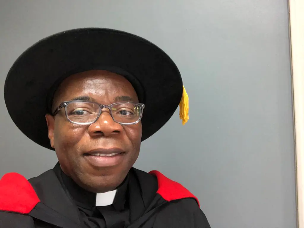 At academic procession: hooding my graduate students