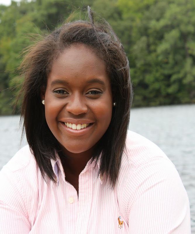 Taylor Ferebee's headshot with a background of water and trees