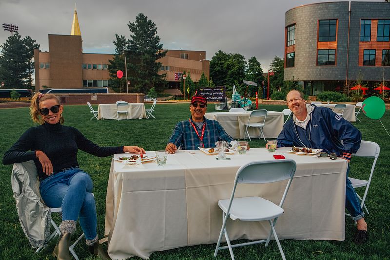 Photo of three PLP faculty at a table