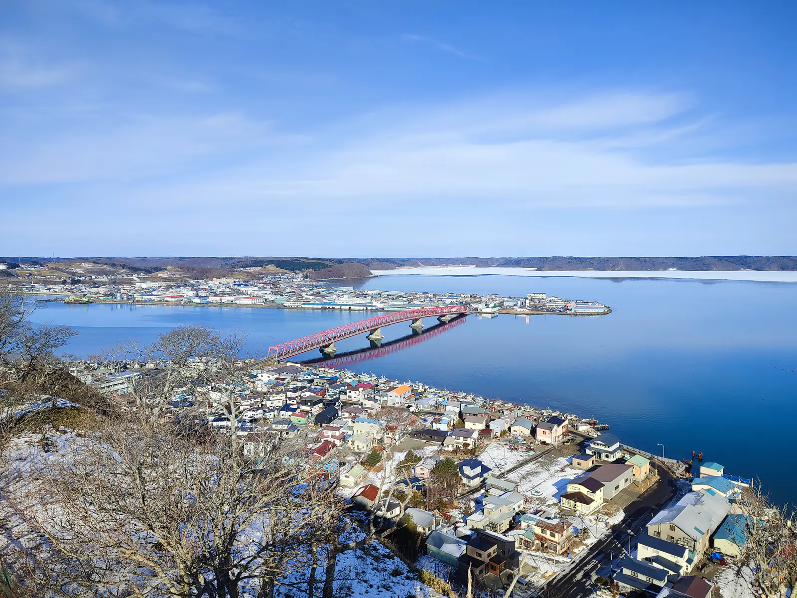 Japan, Hokkaido, Akkeshi (2023): View towards the entrance to Akkeshi Bay, from an elevated multifunctional tsunami evacuation zone and recreational park