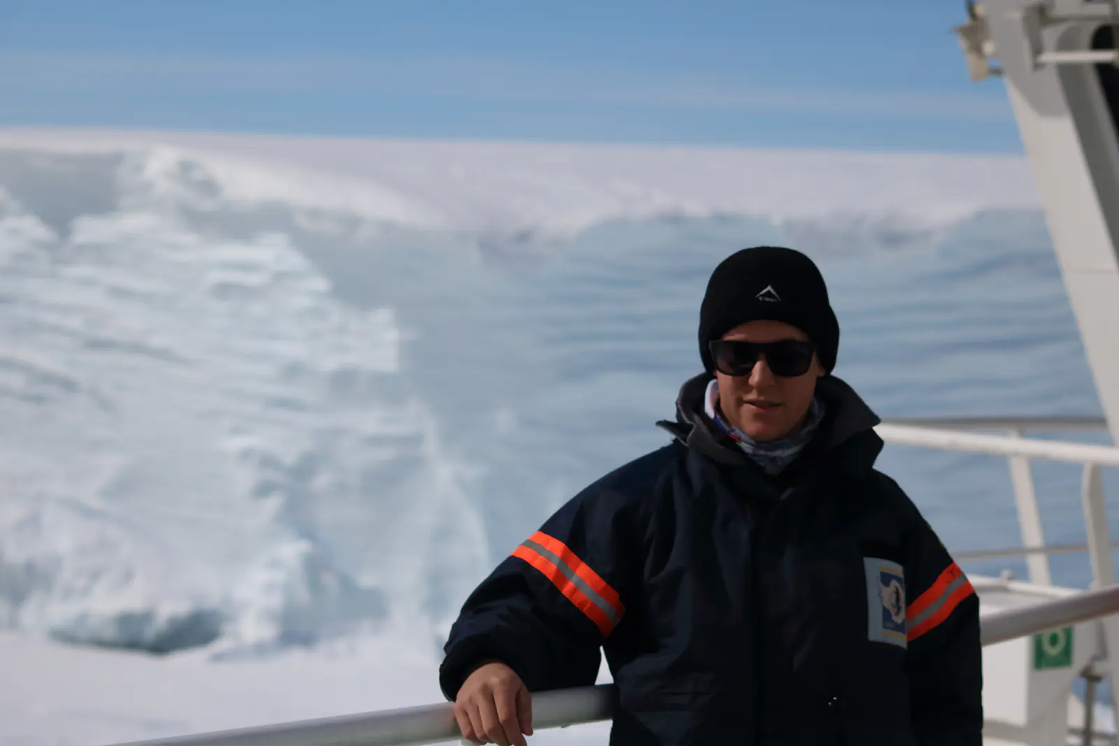 Me standing in front of the Antarctic ice shelf. Credit: Hannes Swart.