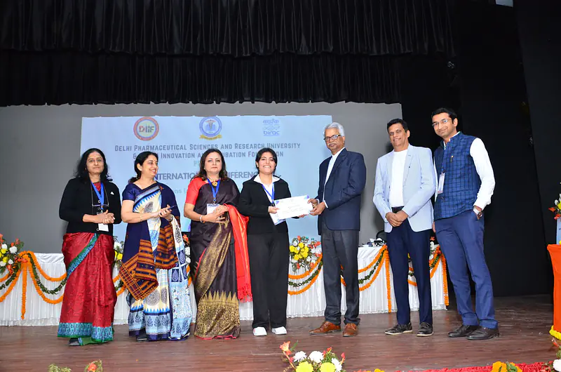 B. Pharm Student Rishika Receiving 1 Prize at ICIDAR 2024 