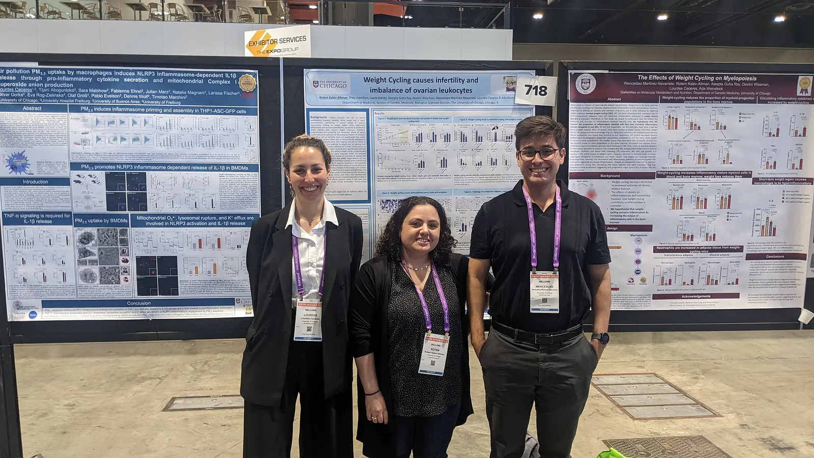 Lourdes, Rotem and Wenceslao in front of posters