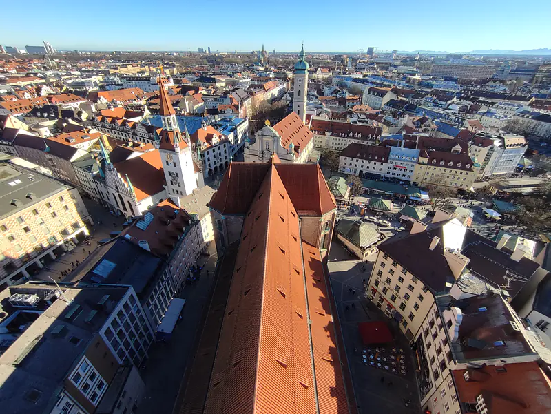 Germany, Bavaria, Munich (2021): View from the church tower of St. Peter - a part of the Alps can be seen along the horizon