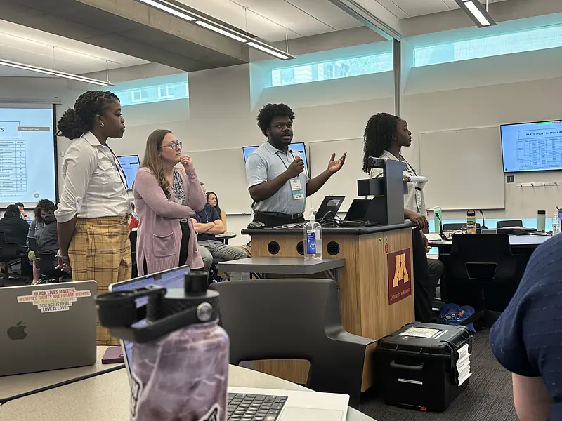 Asu answering an audience question after our co-presented short talk