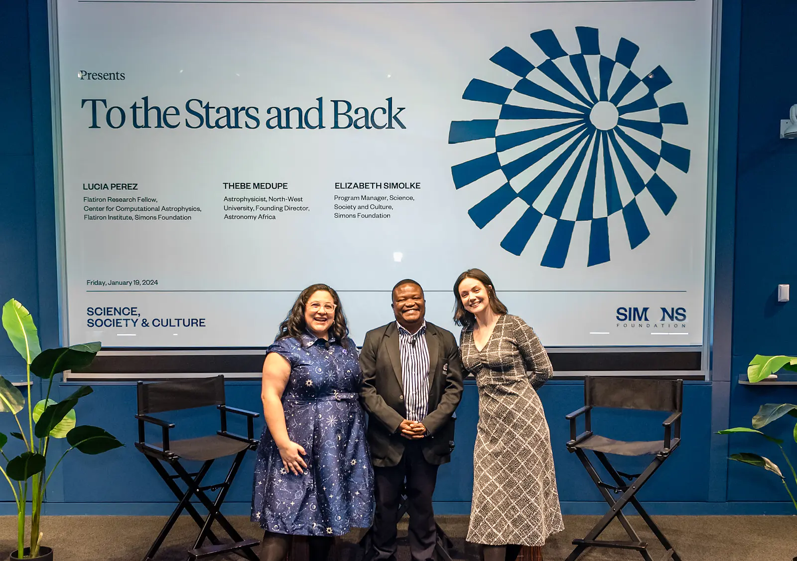 Lucia, Thebe, and Elizabeth pose before the panel